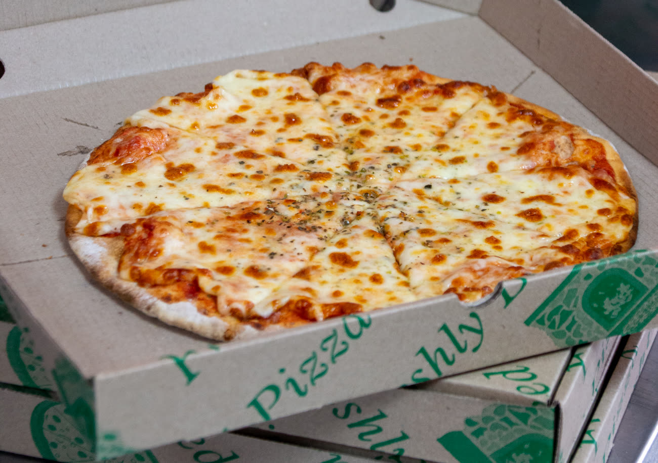 A freshly boxed woodfired pizza ready for collection